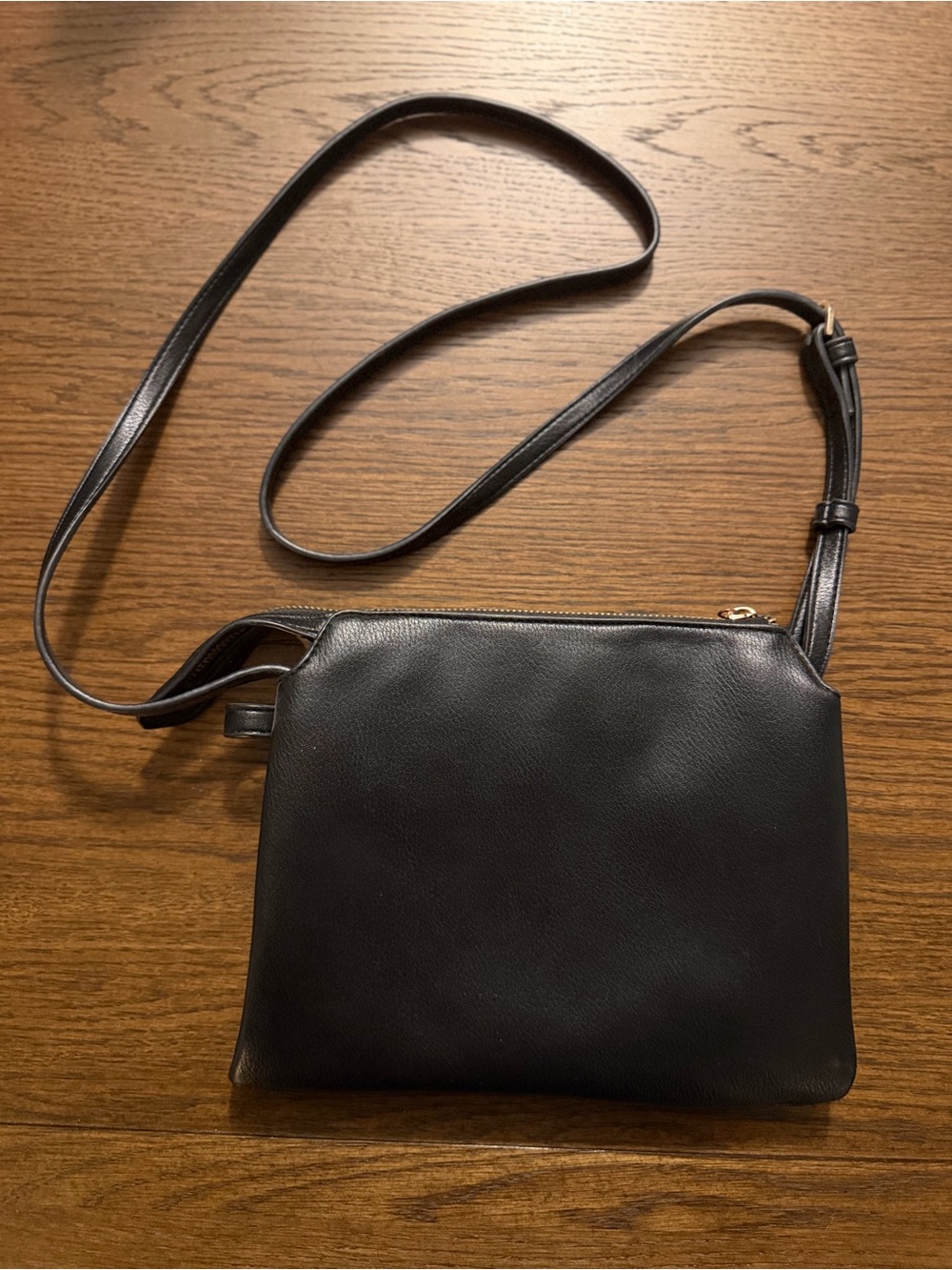 a new day Black Crossbody Bag with Adjustable Strap and Gold Accents